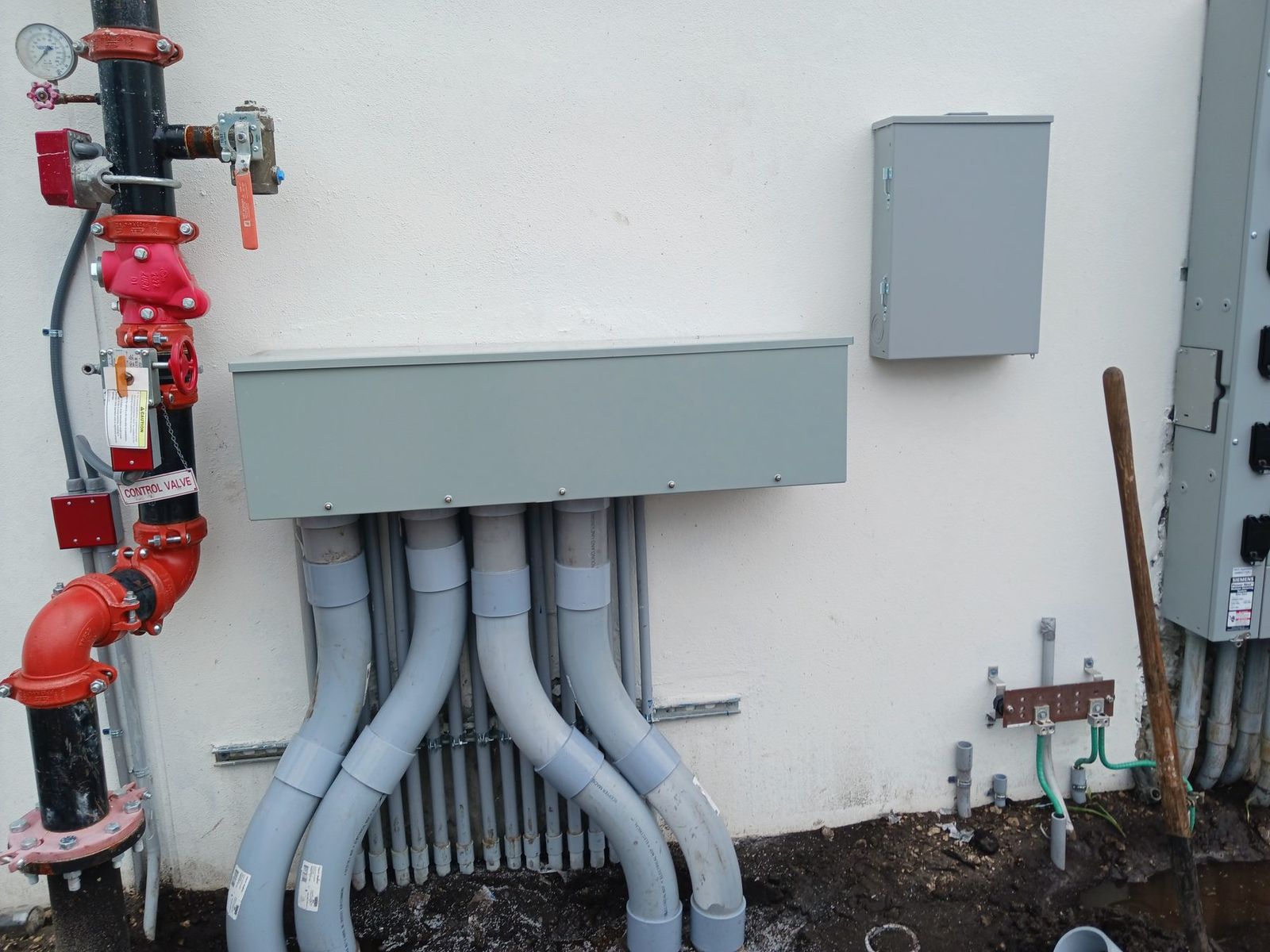 Commercial service equipment with conduit runs entering from below