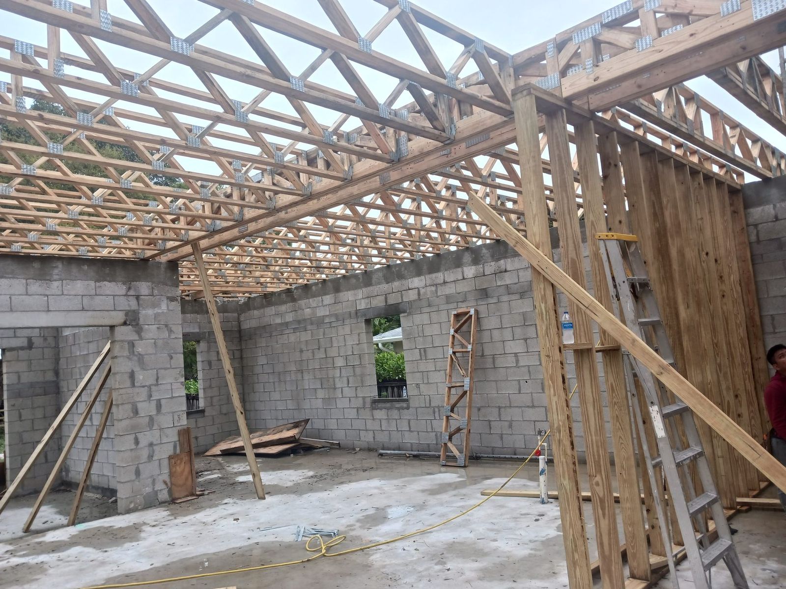 New construction with block walls and roof trusses ready for wiring