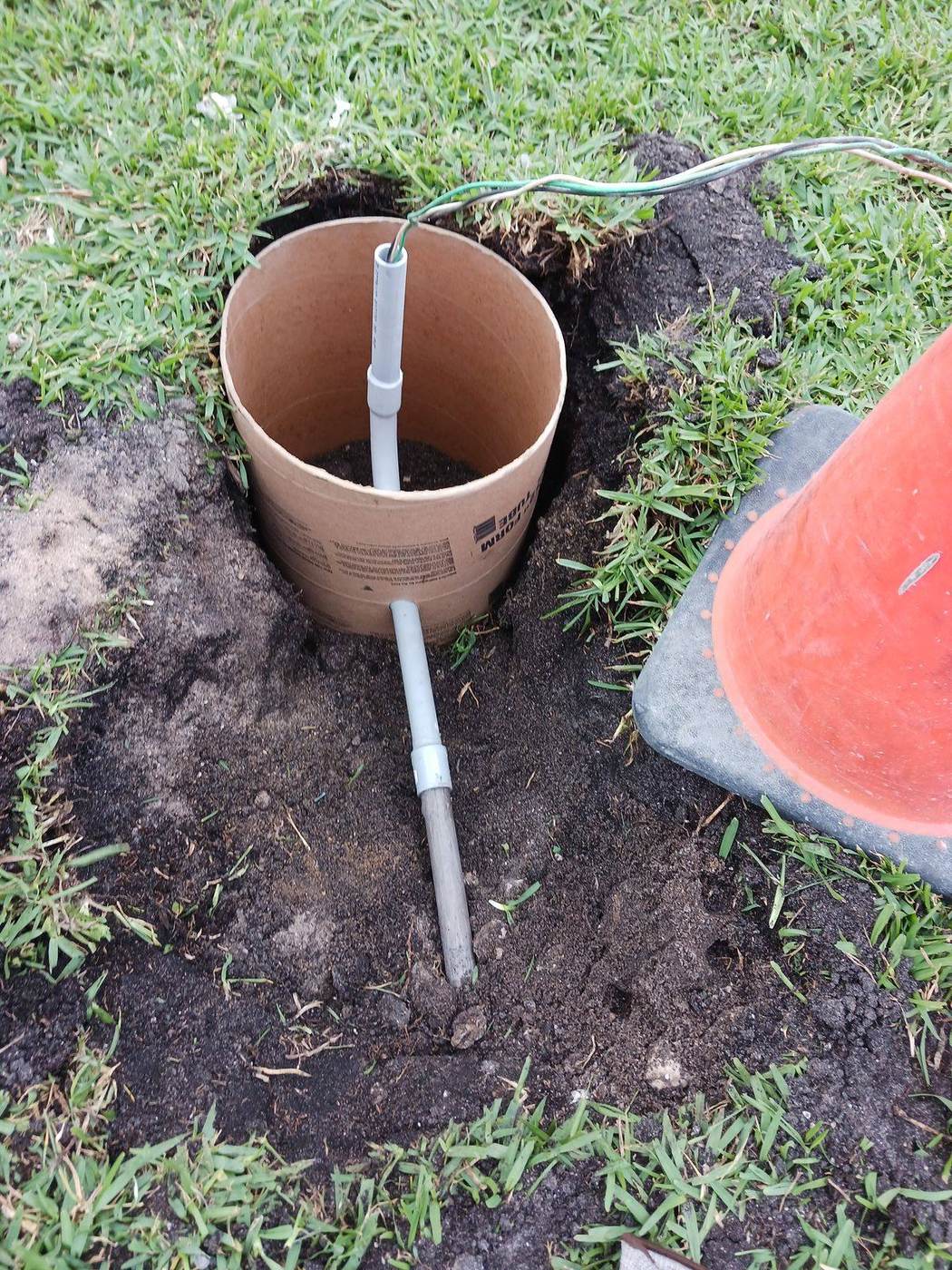 Underground conduit stubbed up into a concrete form tube for a landscape lighting fixture